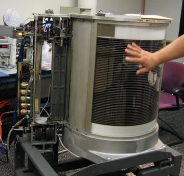 IBM 350 RAMAC disk storage unit with its stack of magnetic disks exposed